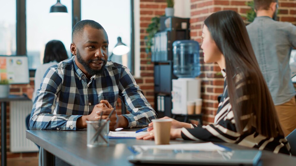 hr-employee-greeting-job-seeker-talk-about-work-recruitment-interviewing-candidate-work-application-meeting-woman-having-conversation-with-man-about-company-employment_482257-43239 hr-employee-greeting-job-seeker-talk-about-work-recruitment-interviewing-candidate-work-application-meeting-woman-having-conversation-with-man-about-company-employment_482257-43239